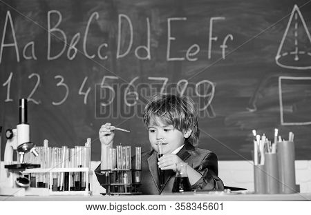Basic Knowledge Primary School Education. Educational Experiment. Boy Microscope And Test Tubes Scho