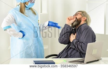 Coronavirus Symptoms. Doctor Protective Equipment Examines Male Patient Suspected Coronavirus Infect