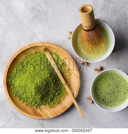 Matcha Green Powder And Tea On Gray Concrete Background