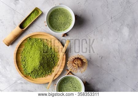 Matcha Green Powder And Tea On Gray Concrete Background