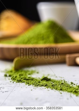Matcha Green Powder And Tea On Gray Concrete Background