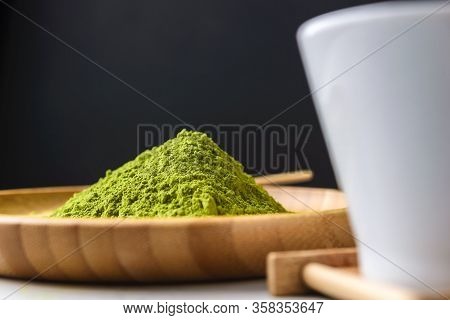 Matcha Green Powder And Tea On Gray Concrete Background