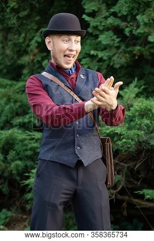 Victorian Steampunk Retro Adwenturer Guy In Bowler Hat With Coin