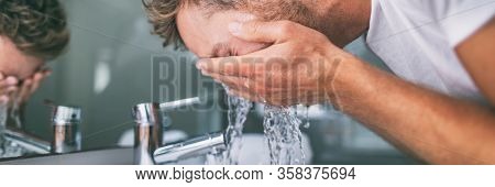 Man washing face splashing water in bathroom sink male skincare beauty morning routine panoramic banner background.