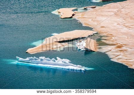 Ice Floes In Azure Water Of Bolshoe Imeretinskoye Lake On Sunny Day At Summer In Caucasus Mountains,