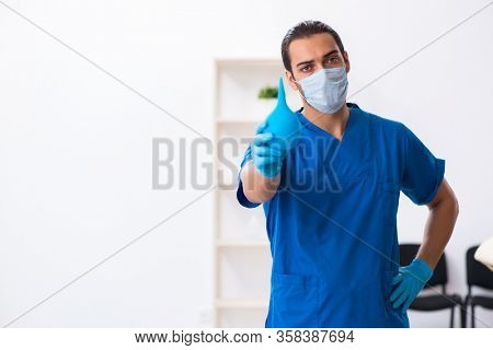 Young male doctor working in the clinic