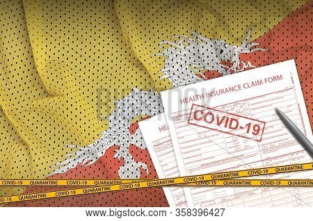 Bhutan Flag And Health Insurance Claim Form With Covid-19 Stamp. Coronavirus Or 2019-ncov Virus Conc
