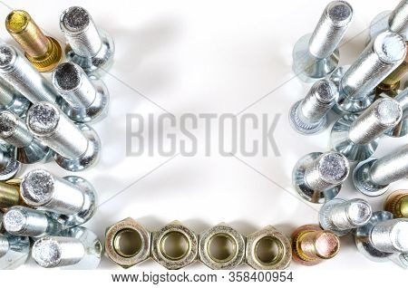Nuts And Upright Studs And Bolts For A Car On A Table With A Place For Inscription