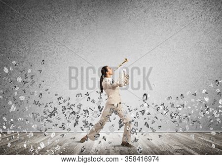 Woman Playing Trumpet Brass Instrument And Flying Various Letters Around. Young Businesswoman In Whi