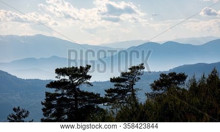 Nice landscape with Cedar trees and mist in valleys, Likya Yolu tourist pathway in Turkey.