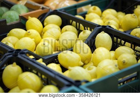 Lemons In Crates On Supermarket. Healthy Food. Vitamins.