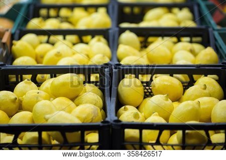 Lemons In Crates On Supermarket. Healthy Food. Vitamins.