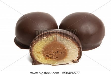 Round Chocolate Candies With Marzipan Filling Isolated On White Background