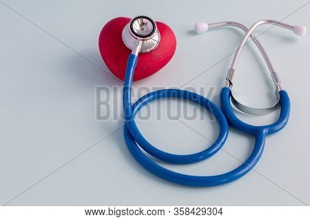 Stethoscope And Heart On A Blue Background.  Medical Concept. Selective Focus. Space For Text.