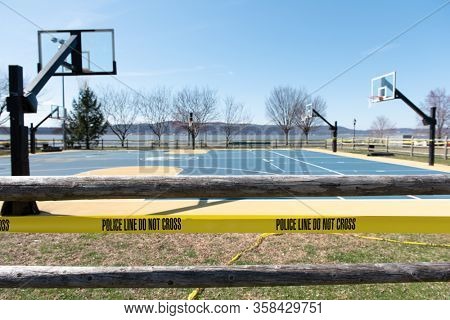 Police line around a basketball court at Scenic Hudson Park in Irvington, NY, USA on 3/21/20. According to Gov. Cuomo, New Yorkers must practice social distancing due to the coronavirus outbreak.