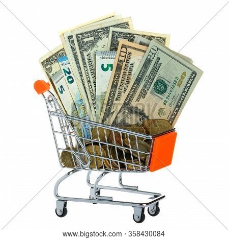 Dollars, Euros, And Coins Are In The Shopping Cart. Selective Focus.