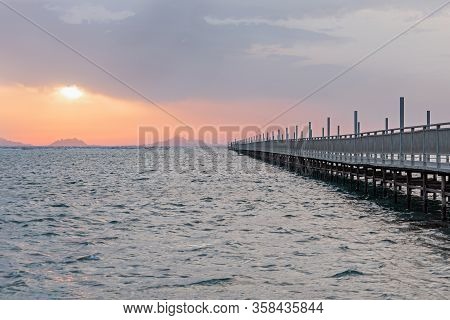 Long Pontoon On The Red Sea In Egypt. Pontoon For Descent Into The Water.