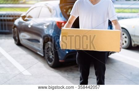 Delivery Man Carrying Cardboard Box For Sending To Receiver Customer By Transportation System Hatchb