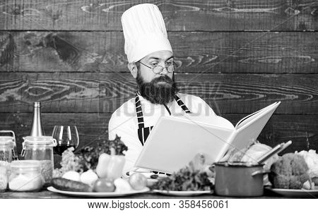 Checking Shopping List. Vitamin. Man Use Kitchenware. Dieting With Organic Food. Fresh Vegetables. C