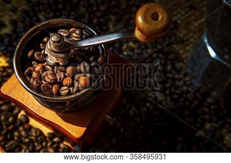 Close Up Coffee Bean Roasted In Vintage Style Of Manual Grinder