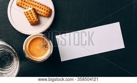 One Portion Of Espresso In Glass Transparent Cups, Bisuits And White Rectangular Paper Card For Text
