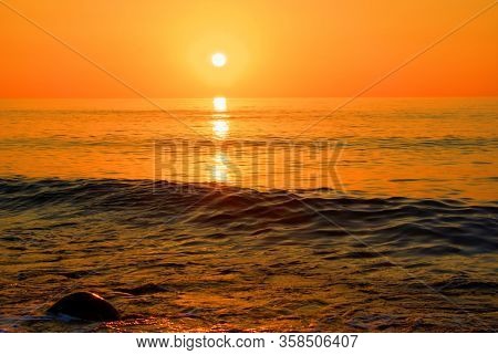 orange sunset on the Tyrrhenian Sea from the coast of Sicily 