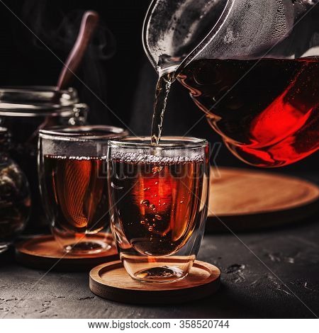 Process Brewing Tea, Tea Ceremony, Cup Of Freshly Brewed Black Tea, Dark Moody.hot Water Is Poured F