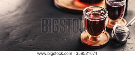 Cup Of Freshly Brewed Black Tea, Dark Moody, Tea Ceremony. Hot Water Is Poured From The Kettle Into 