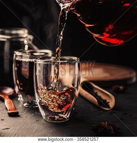 Process Brewing Tea, Tea Ceremony, Cup Of Freshly Brewed Black Tea, Dark Moody.hot Water Is Poured F