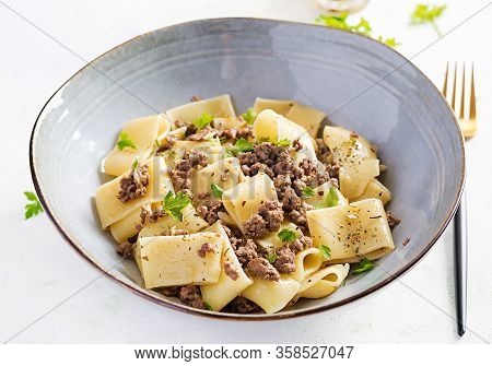 Pasta Calamarata With Minced Meat In Blue Bowl. Italian Cuisine.