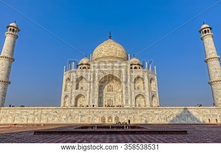 Agra, India - March 5 2018: Wide Lens Shot Of The Famous The Taj Mahal, With Tourists Sighteseeing, 