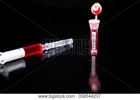 Syringe, Coronavirus In Vitro, Vactin In Vitro On A Black Background