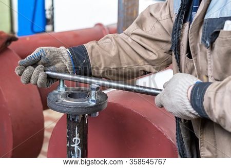 Fitter Assembler Is Assembling A New Gas Pipeline Line In A Gas Boiler Room.