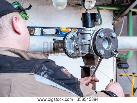 Fitter Assembler Is Assembling A New Gas Pipeline Line In A Gas Boiler Room.