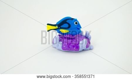 Rome Italy. March 30. 2020. Doris Fish On Corals Isolated On White Background.there Are Plastic Toys