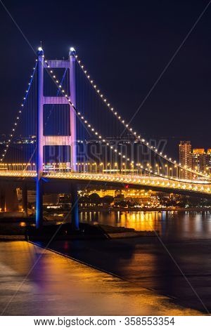 Sunset and light illumination of Tsing ma bridge landmark suspension bridge in Tsing yi area of Hong Kong China.