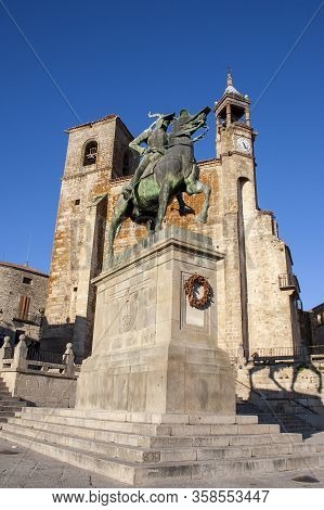 Statue Of Hernán Cortes In The Plaza De Trujillo With A Church In The Background