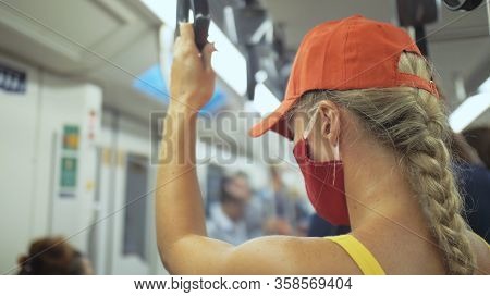 Woman Travel Caucasian Ride At Overground Train Airtrain With Wearing Protective Medical Mask. Girl 