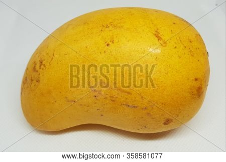 A Picture Of Ripe Mango Ready To Eat On A White Background
