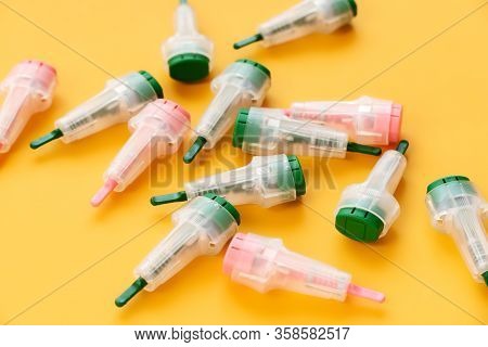 Scarifiers For Blood Sampling On A Yellow Background. Healthcare Concept, Tools For Laboratory Blood