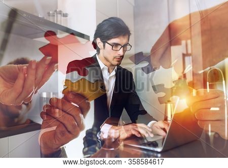 Businessman Works From Remote At House With A Laptop Due To Coronavirus Quarantine.