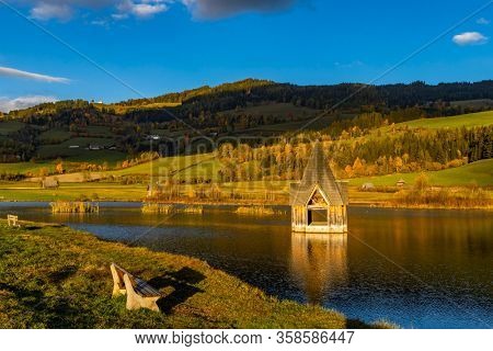 autumn pond under the mountains, Murau district,
Styria, Austria
