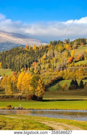 autumn pond under the mountains, Murau district,
Styria, Austria