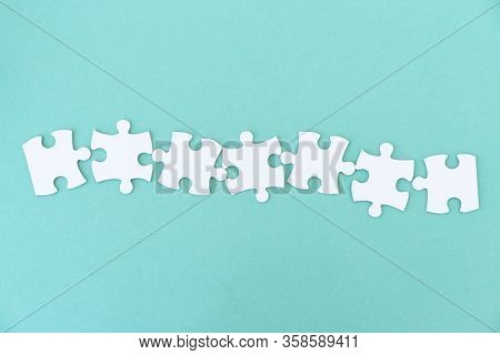 Jigsaw puzzle pieces in a row for inscription, 7 pieces