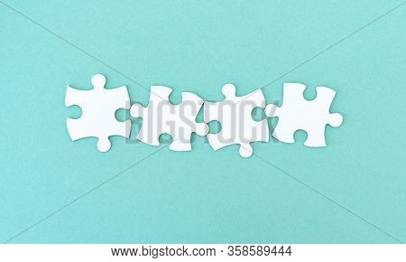 Jigsaw puzzle pieces in a row for inscription, 4 pieces