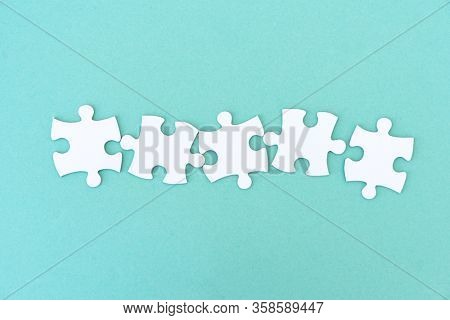Jigsaw puzzle pieces in a row for inscription, 5 pieces