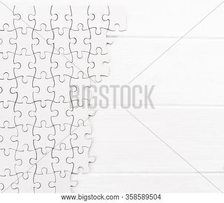 Matching pieces of empty puzzle on white background