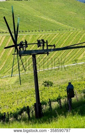 vineyard with windmill called klapotetz in south of Styria, Austria