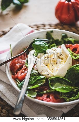 Italian Salad With Buratta Cheese In White Bowl, Selective Focus