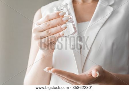 Women Washing Hands With Antibacterial Sanitizer Gel. Hygiene Concept. Prevent The Spread Of Germs A